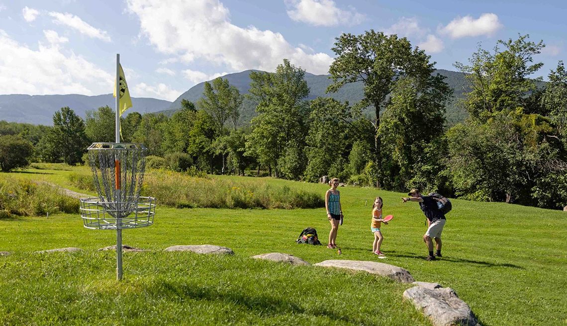 Disc Golf Course Destinations several people on a disc golf course