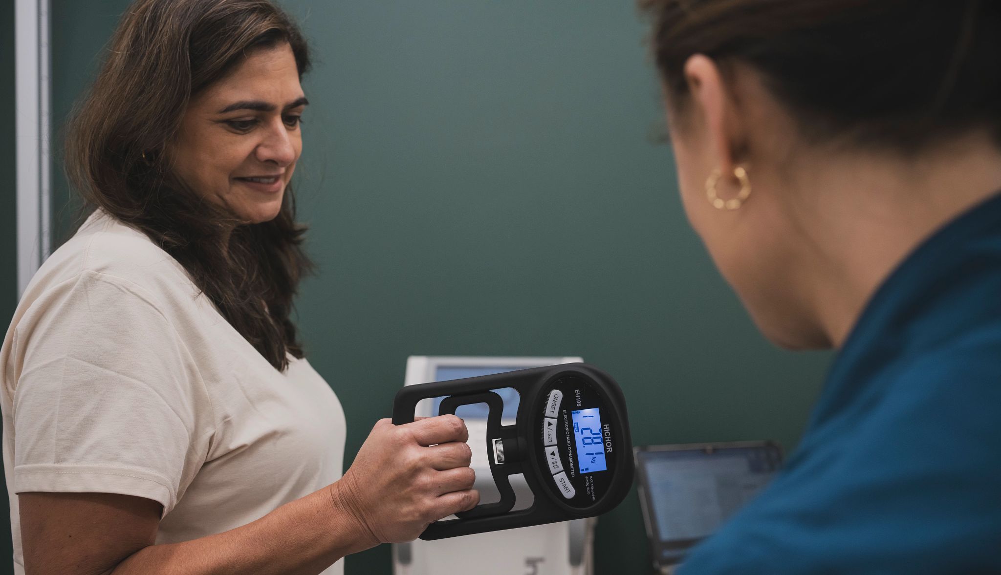 a person working on grip strength at a clinic