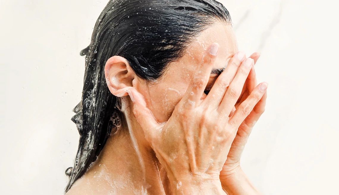 Tips to Wake Up a Tired Face a person showering