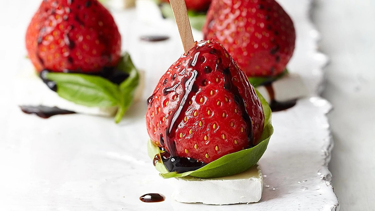 A close-up view of strawberry and brie bites