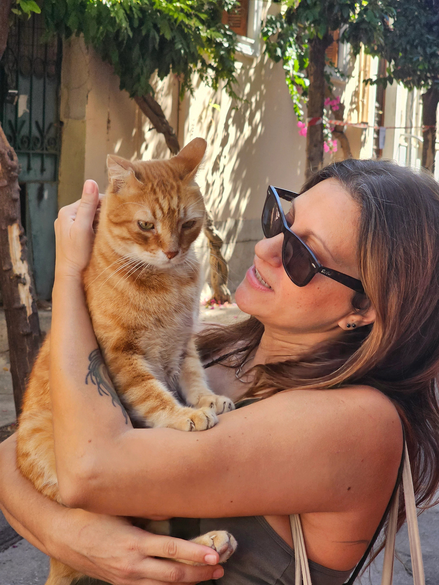 a woman holding a cat