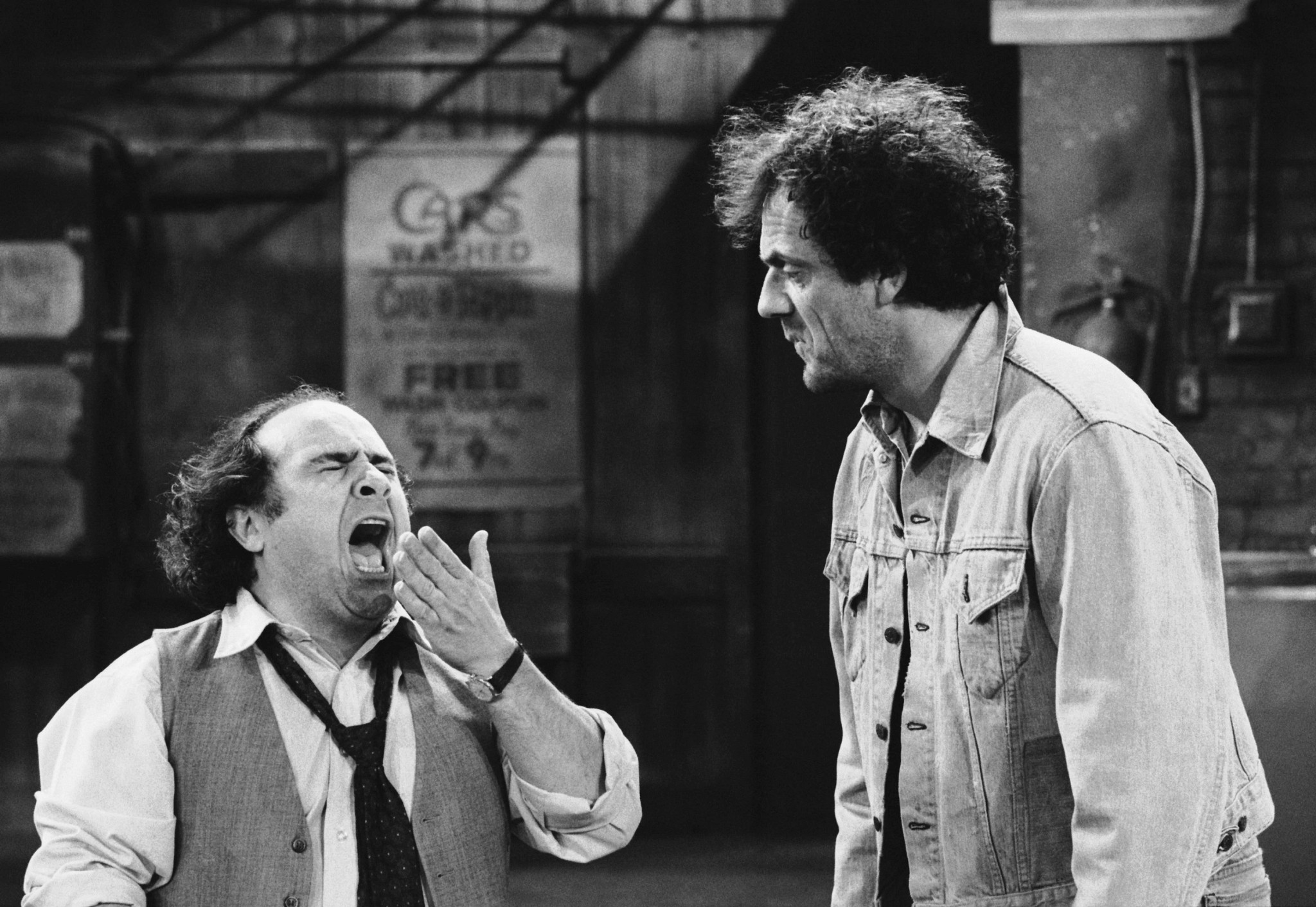 danny devito and christopher lloyd in a scene from an episode of taxi