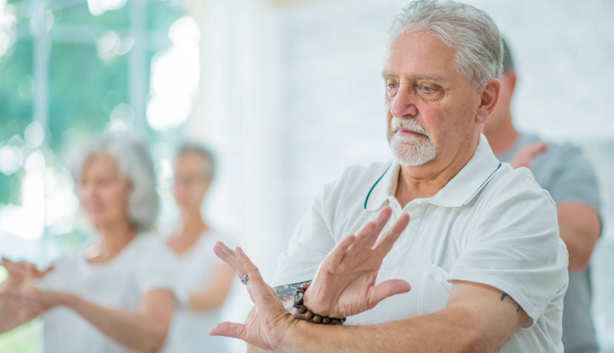 Man participating in Tai Chi Man participating in Tai Chi