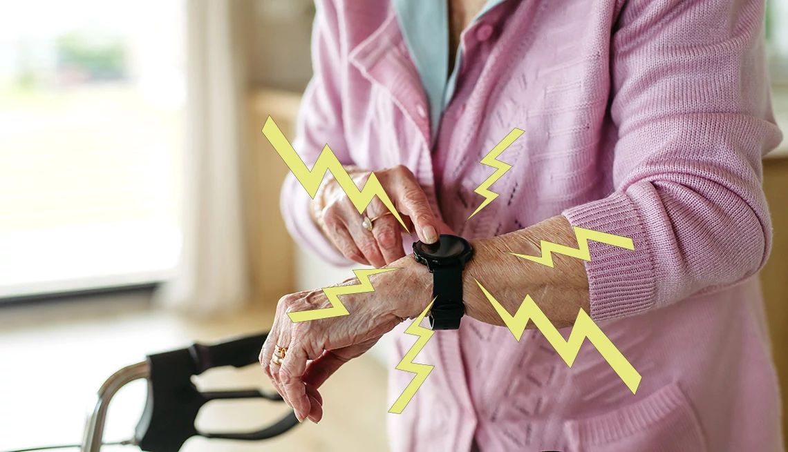 How to Choose a Medical Alert System close up of woman looking at medical alert watches on her wrist