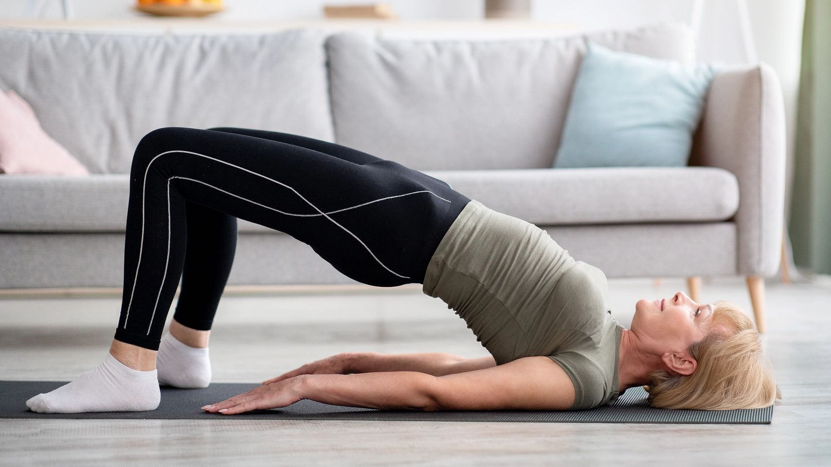 Exercises to Lower Blood Pressure woman doing glute bridge
