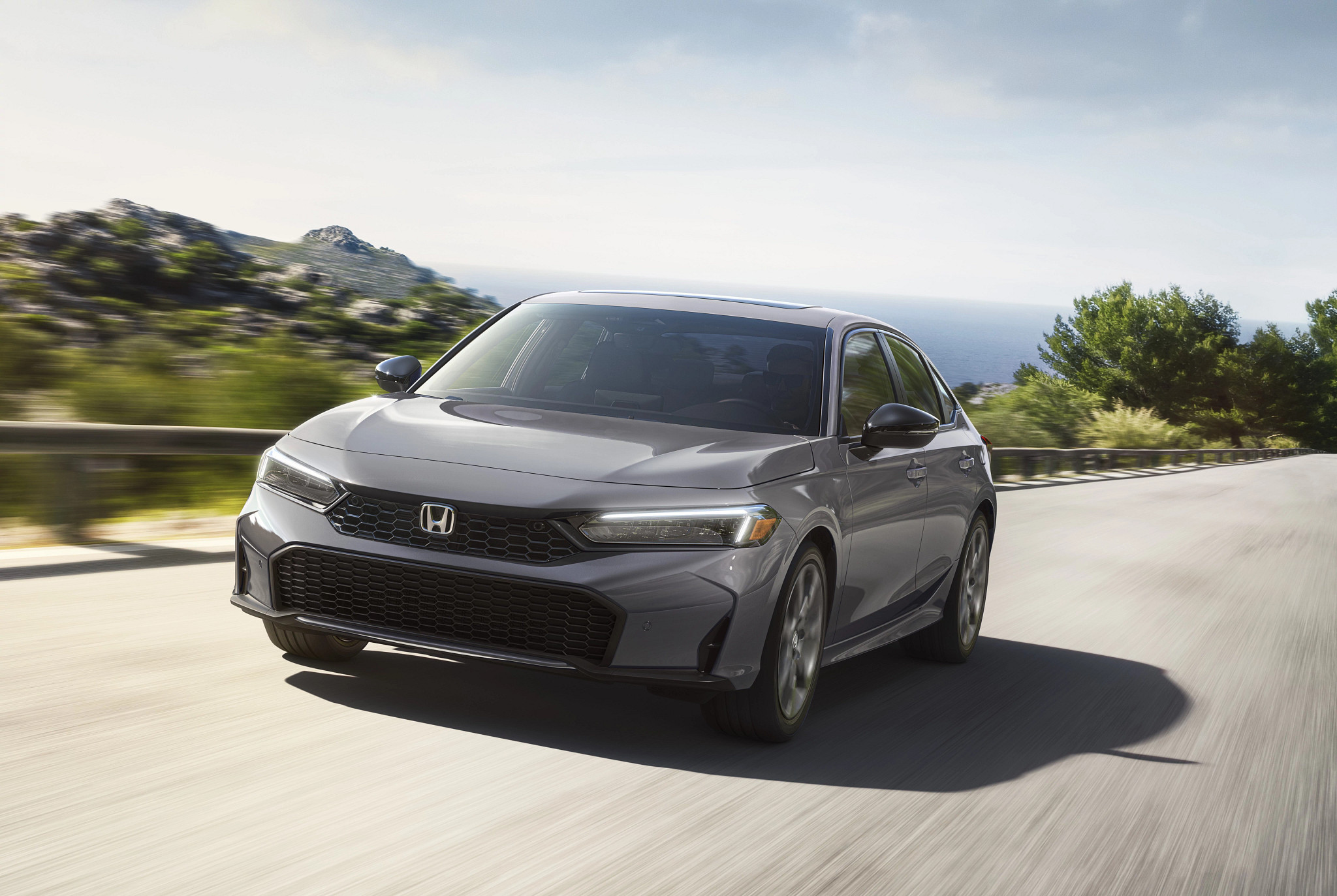 a honda civic touring hybrid is shown in a photo