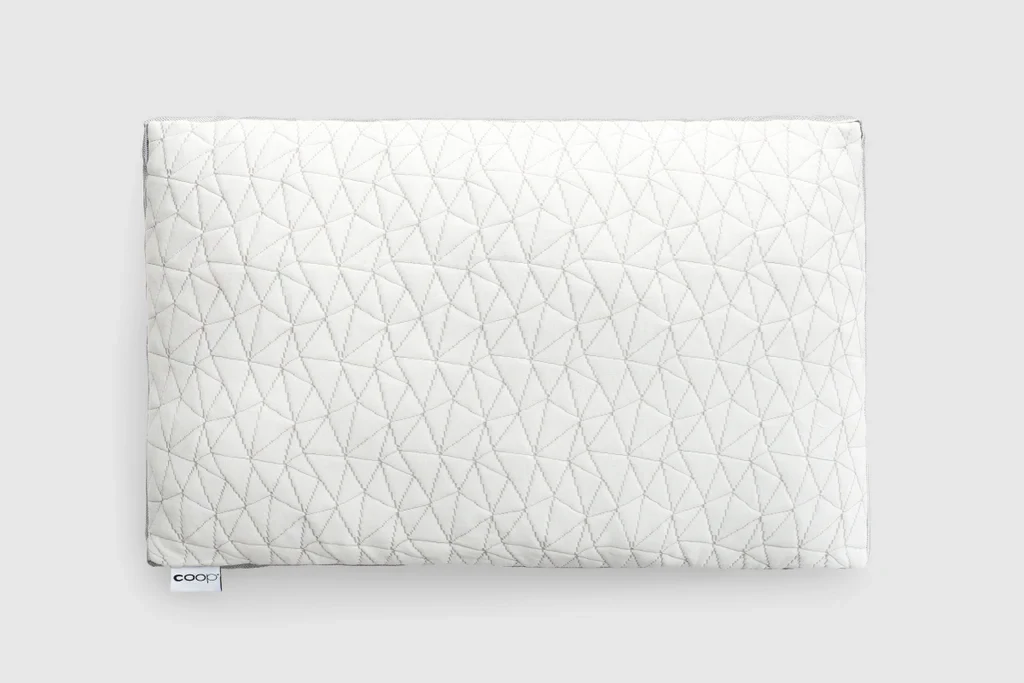 The Coop Eden Adjustable Pillow lying flat on a plain white background