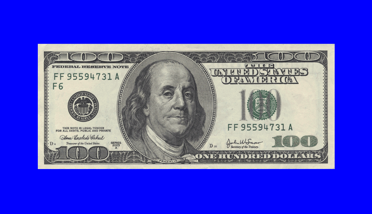 a one hundred dollar starts to disappear on a bright blue background