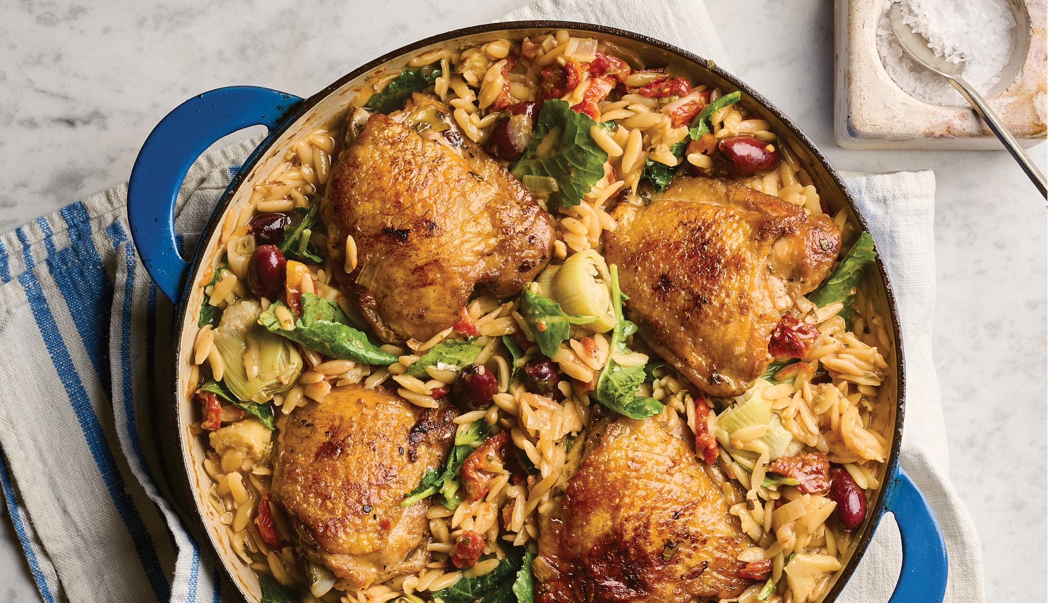 Giada De Laurentiis’ One-Pan Chicken with Artichokes and Orzo a dish of chicken, artichokes and orzo