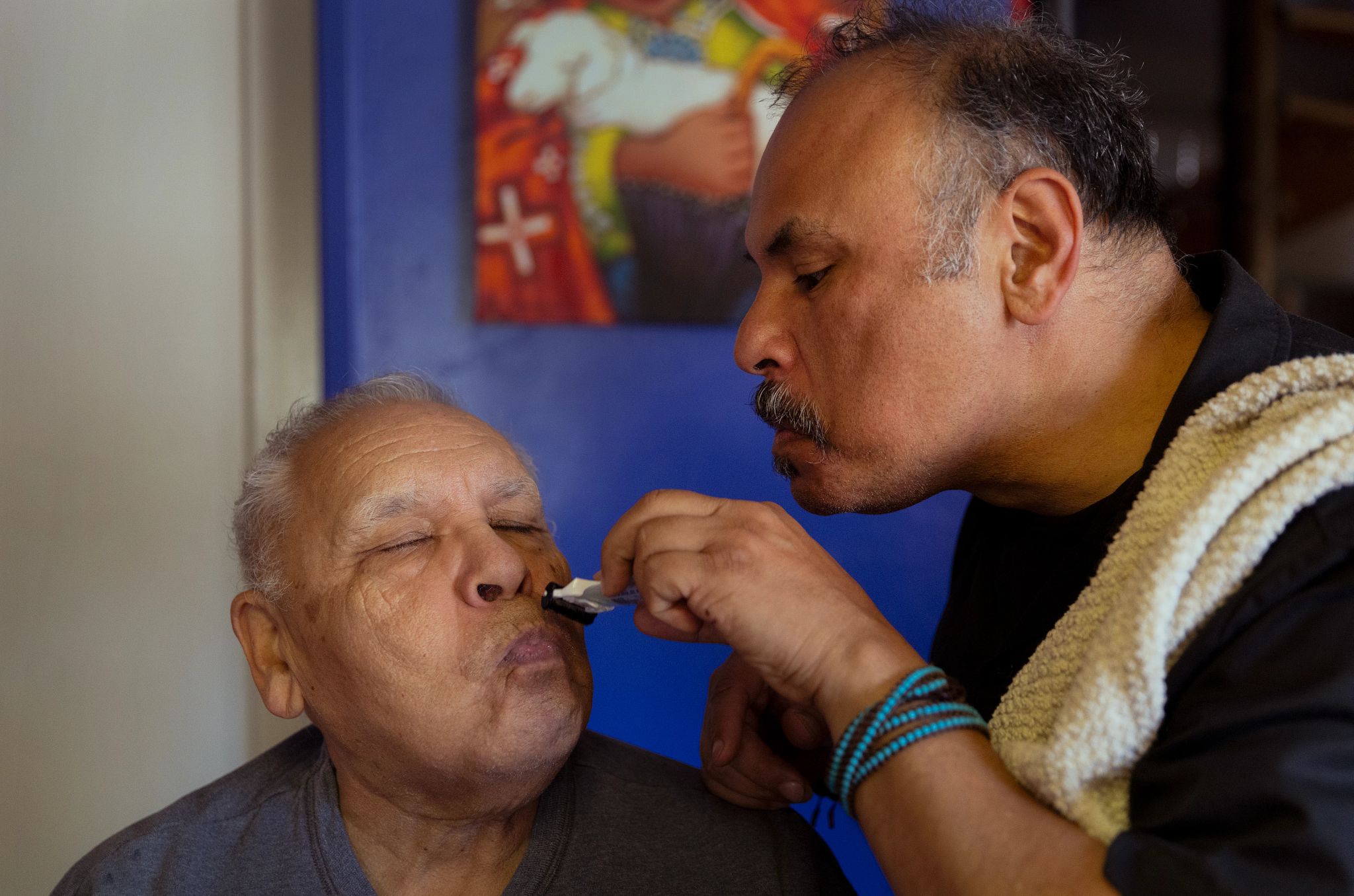 Best AARP Photos of 2024 a man helping another man shave