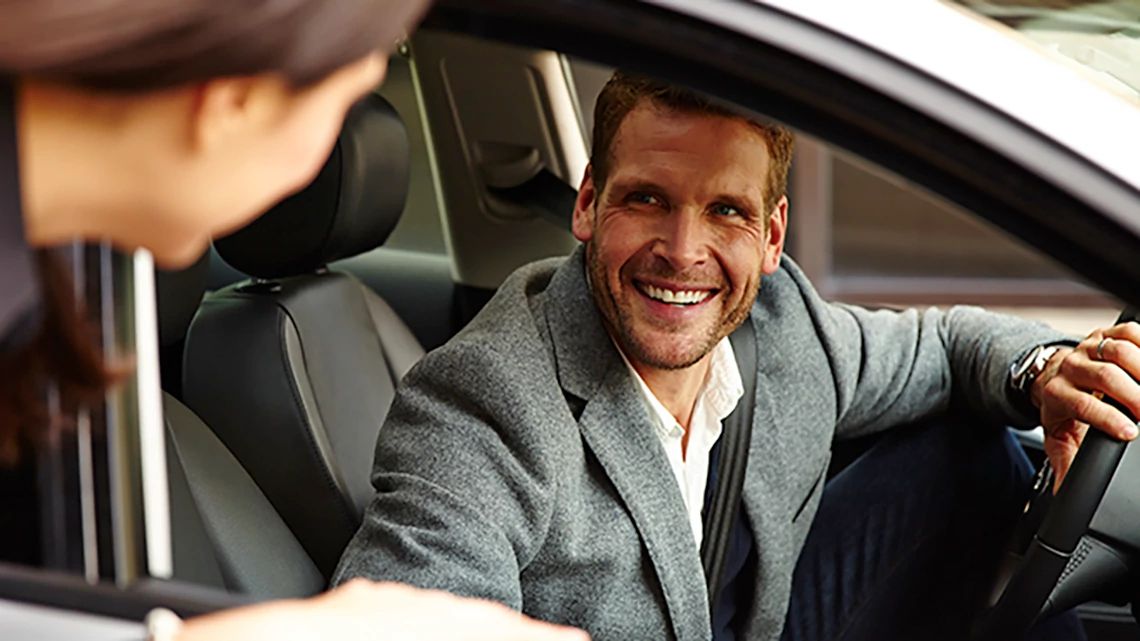 Man on a driver seat of a car