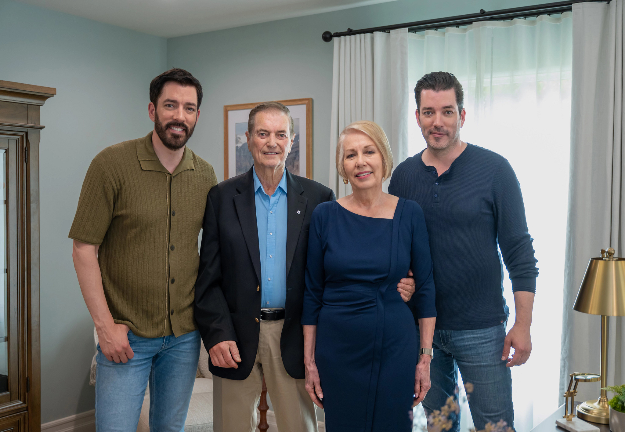 The Property Brothers (Drew and Jonathan Scott) are pictured with their parents, Jim and Joanne Scott. The twins recently helped their parents update their new home.