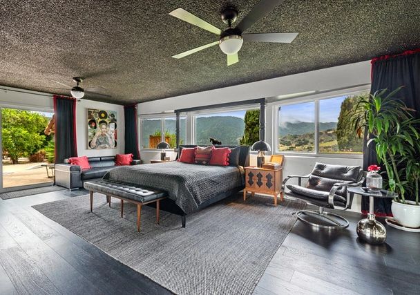 Johnny Cash home a bedroom with black and red decor