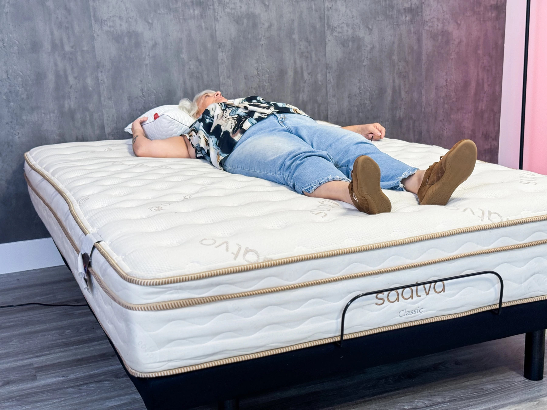 A woman back-sleeping on the Saatva Classic mattress