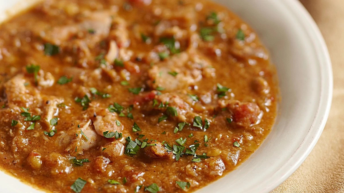 A close-up view of Ethiopian-spiced chicken stew on a bowl