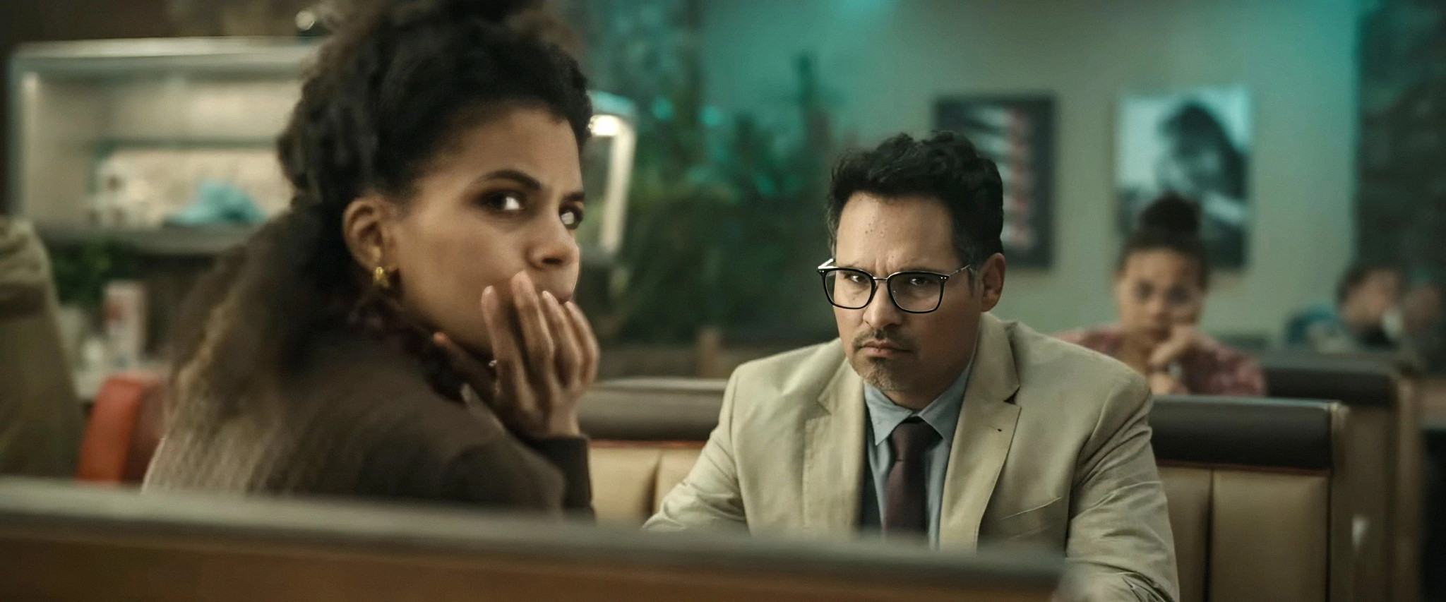 zazie beetz and michael peña in a scene from good luck have fun don't die