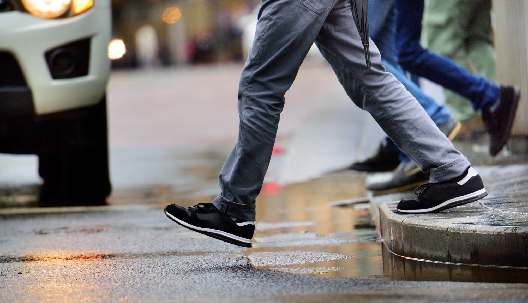 AARP Pushes to Protect Pedestrians pedestrians cross the street in front of a vehicle