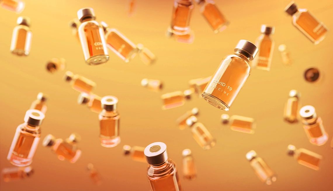 Fall COVID Vaccines covid vaccine vials on orange background