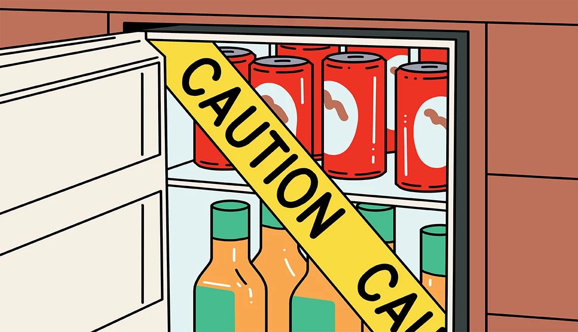 Avoid Hotel Minibar Fees caution tape over a fridge