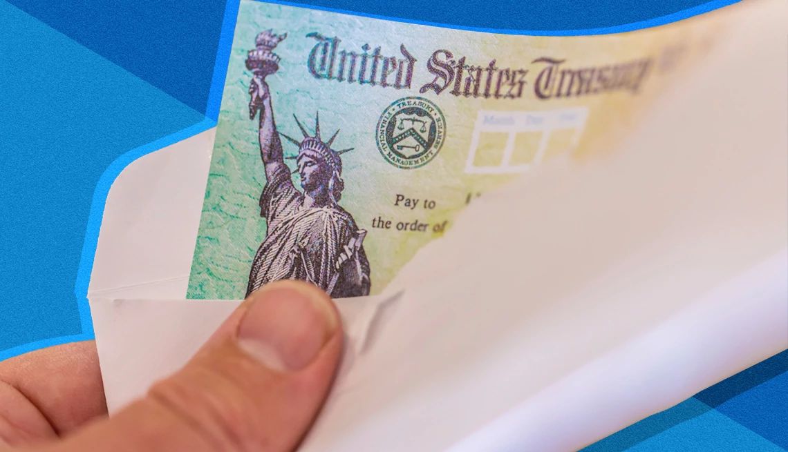 Social Security Chief Responds to Cuts a hand holds a social security check