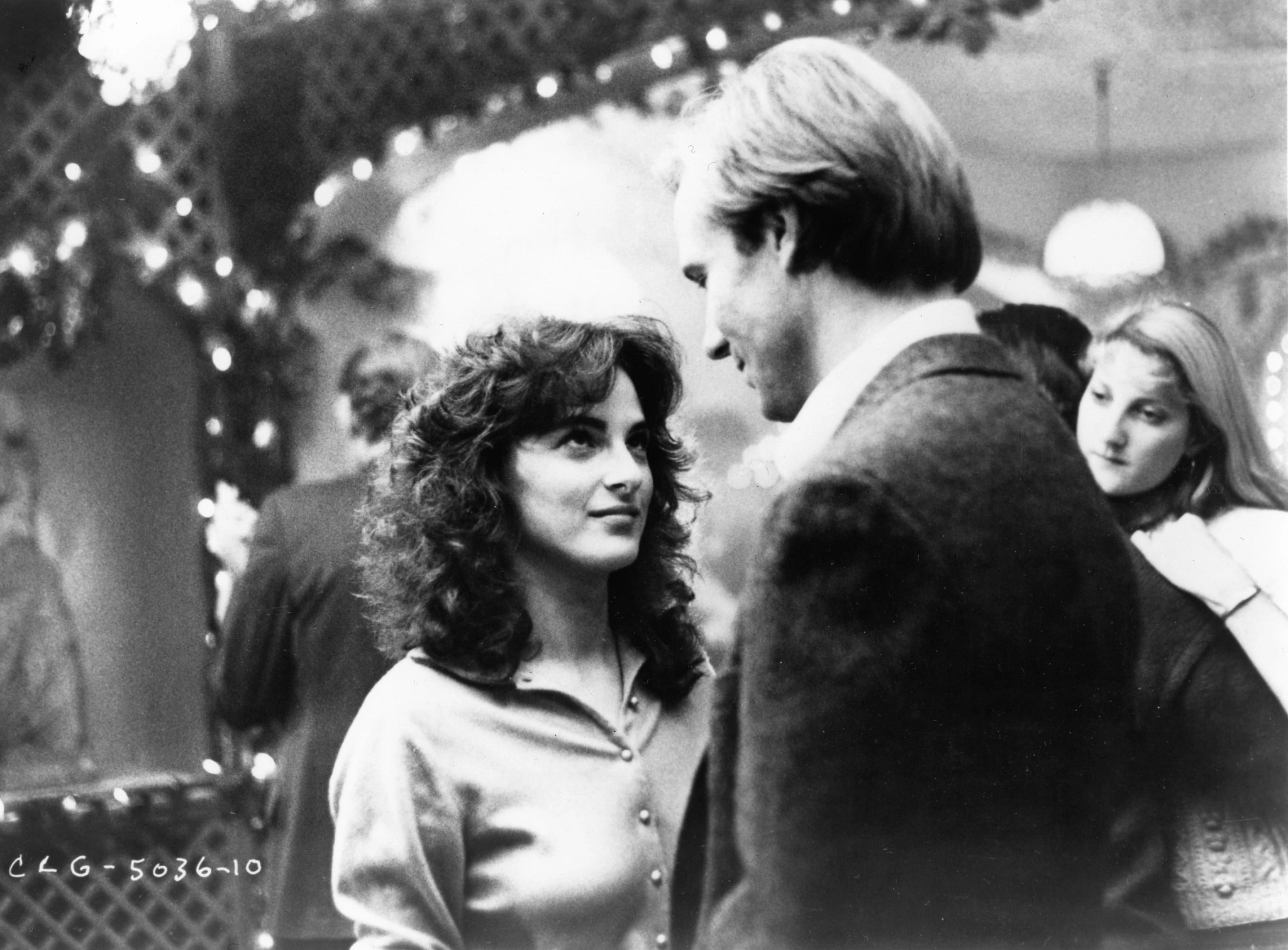 Marlee Matlin and William Hurt stand close to each other in an intimate moment in a black and white image from the movie "Children of a Lesser God."