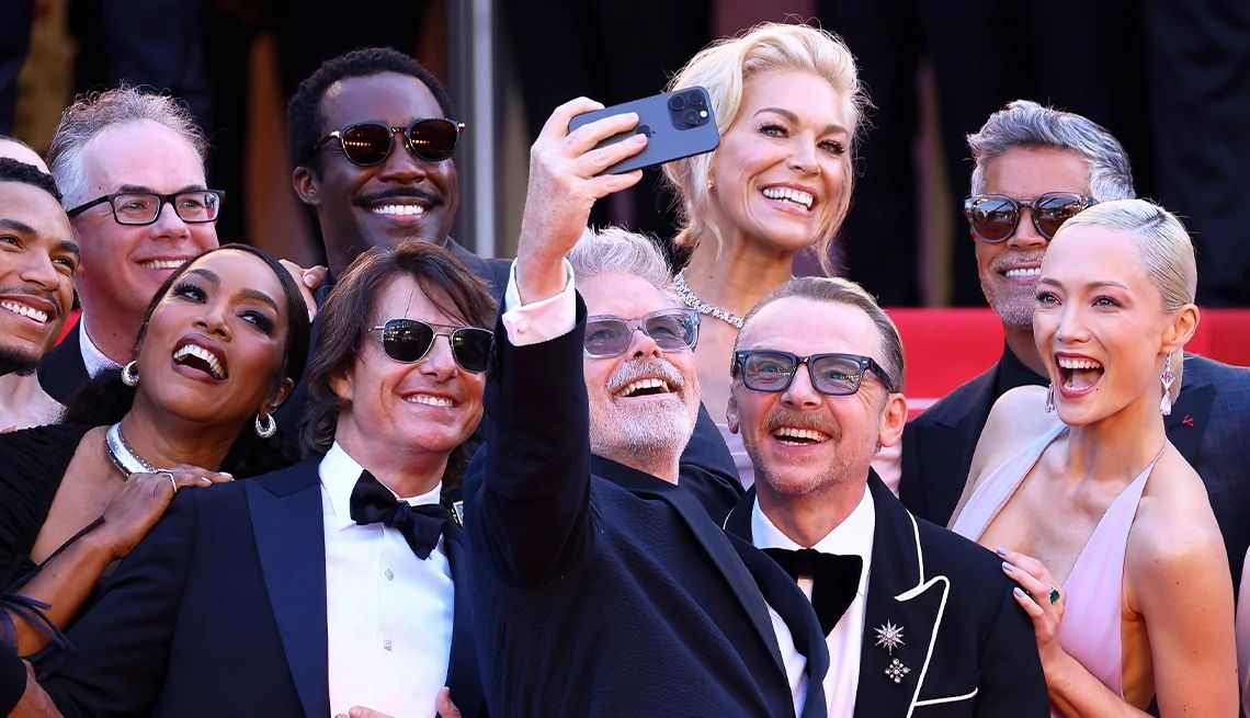 7 Ways to Look Better in Any Picture the cast of mission impossible the final reckoning gathering to smile for a selfie