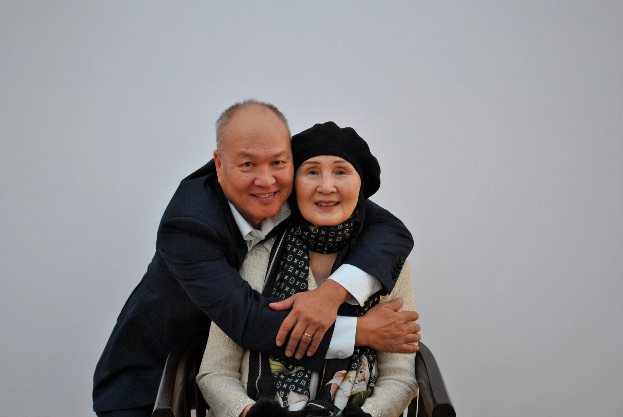 A photo shows author Minh Nguyễn celebrating his mother’s 79th birthday with her