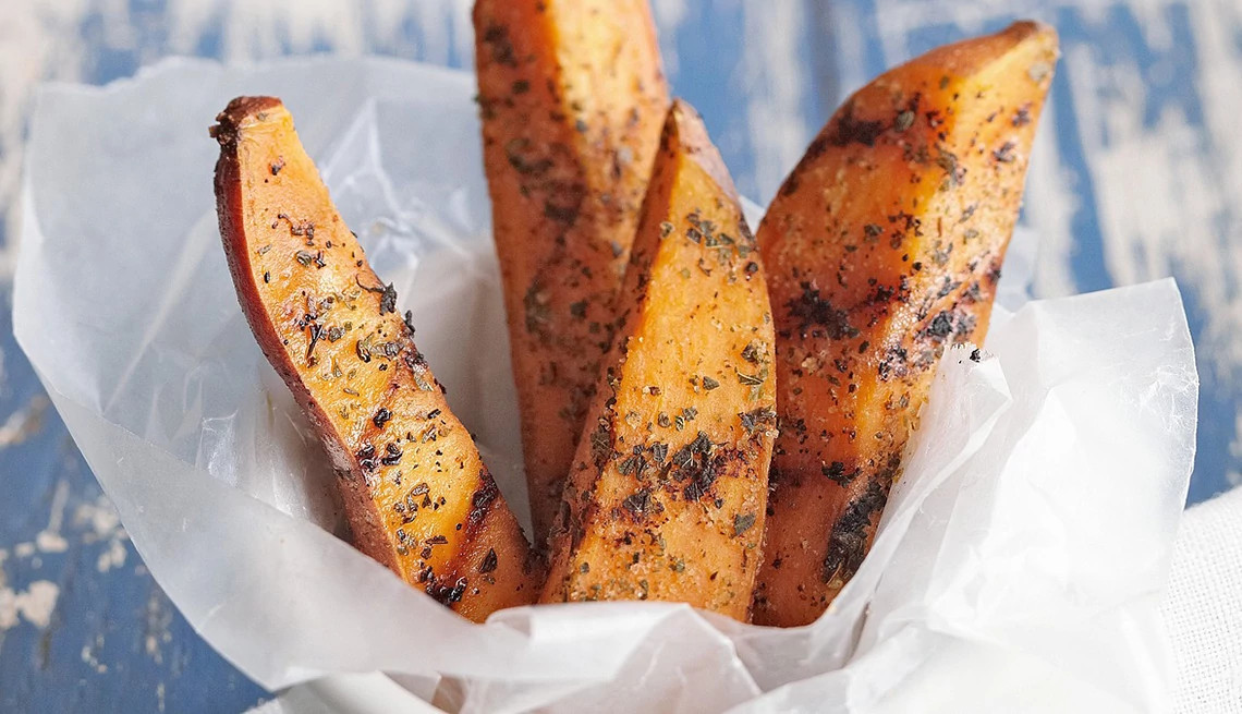 A close-up view of grilled sweet potato wedges