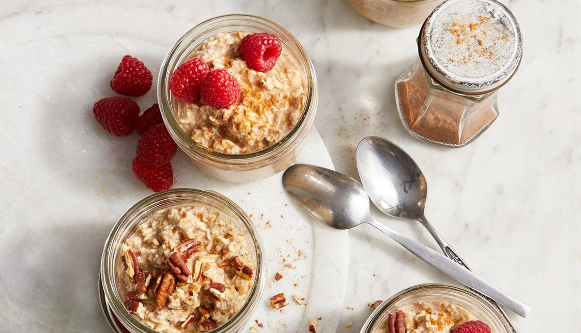 A close-up view of cinnamon roll overnight oats in jars
