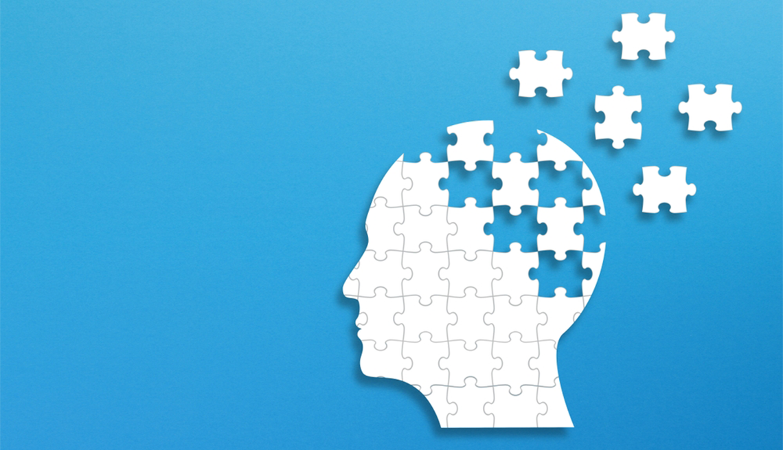 “The New Brain Economy” explores themes such as shaping healthy aging and disparities in brain health equity A silhouette of a person's head as puzzle pieces on a blue background
