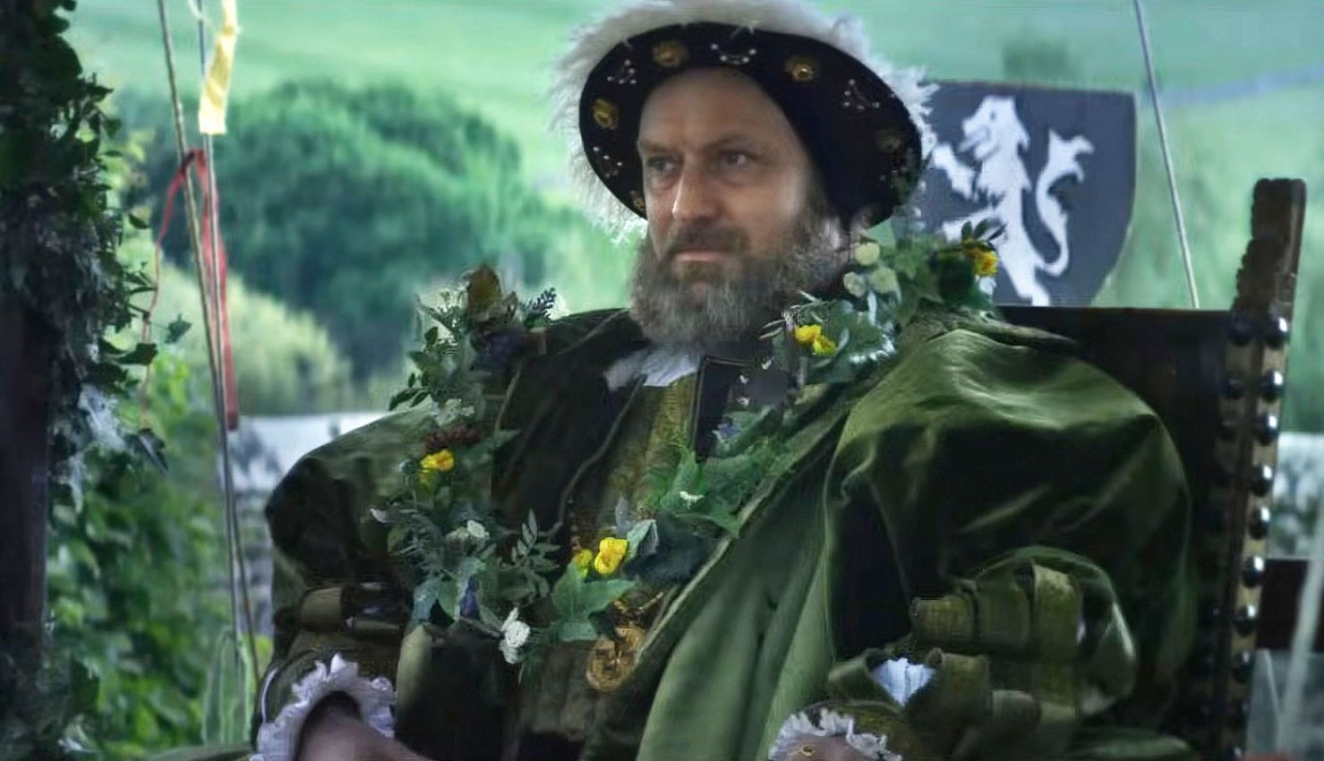 Jude Law in Firebrand Jude Law sitting in a chair as Henry VIII in the film Firebrand
