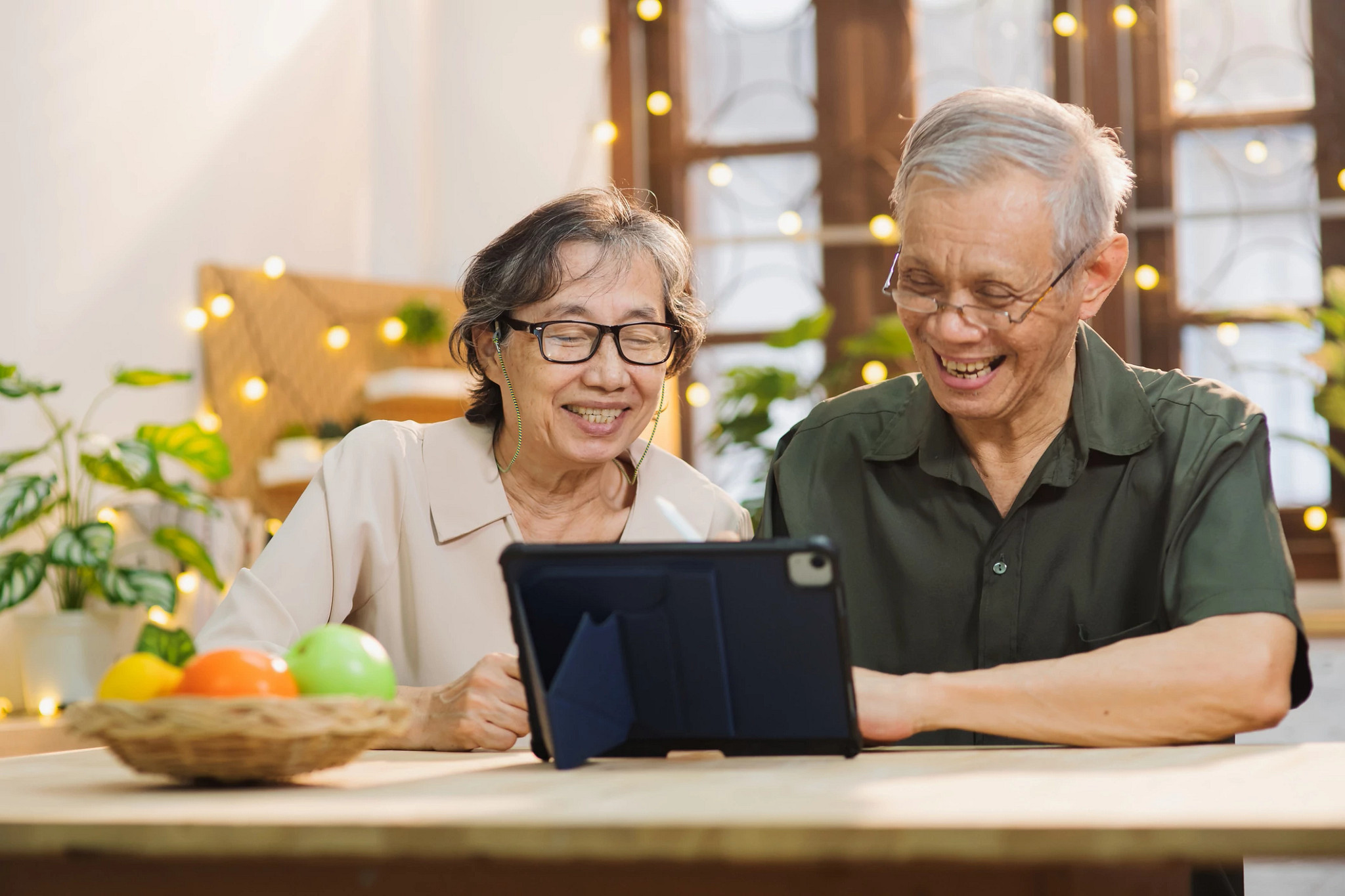 two people looking at a tablet