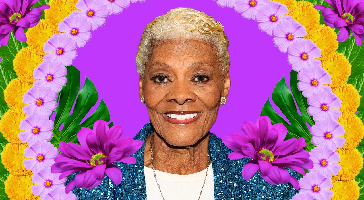 Close-up portrait of Dionne Warwick smiling, set against a vivid purple background, surrounded by colorful flowers and tropical leaves