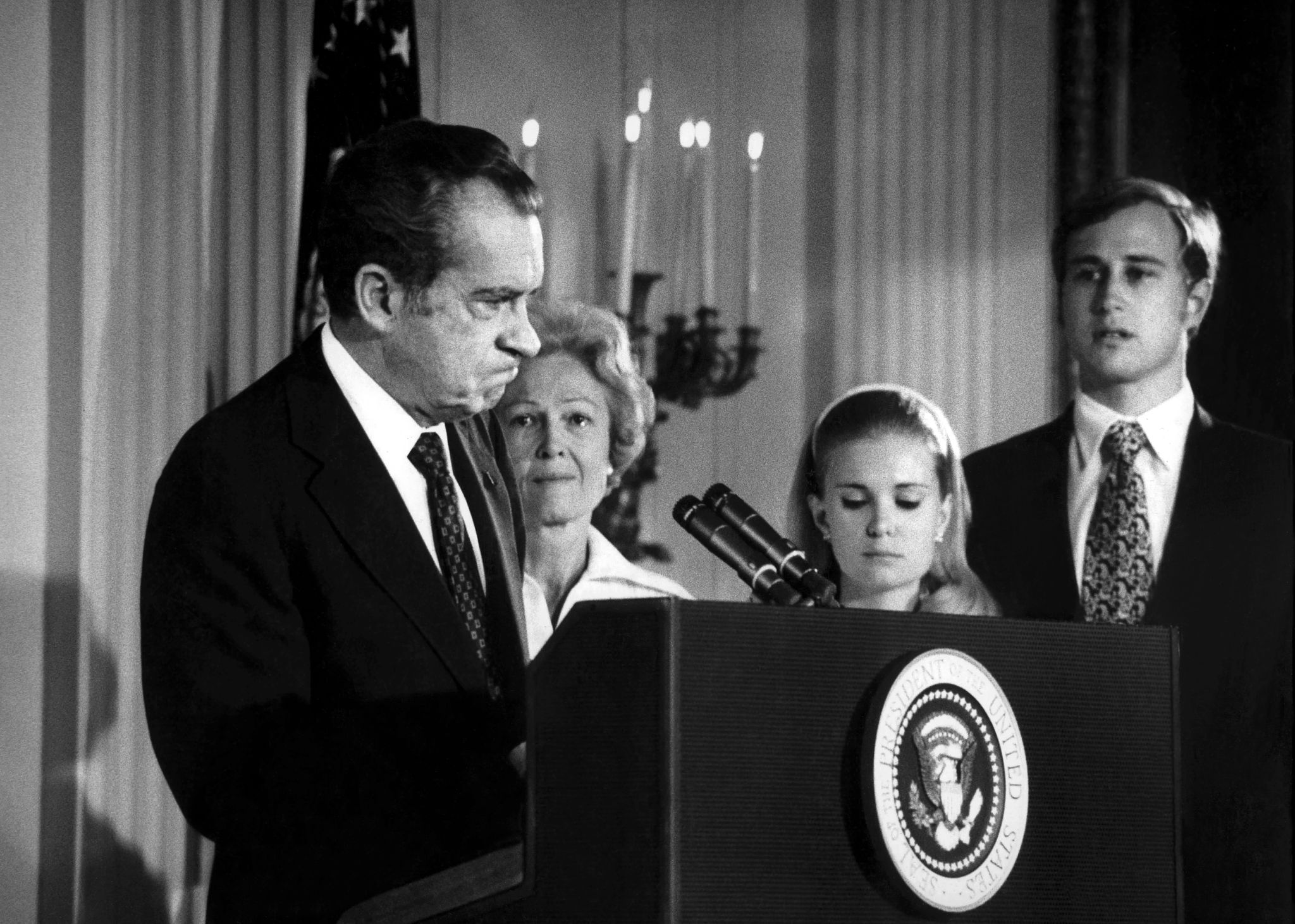 President Richard Nixon resigns richard nixon speaks at a podium. his wife and children are in the background