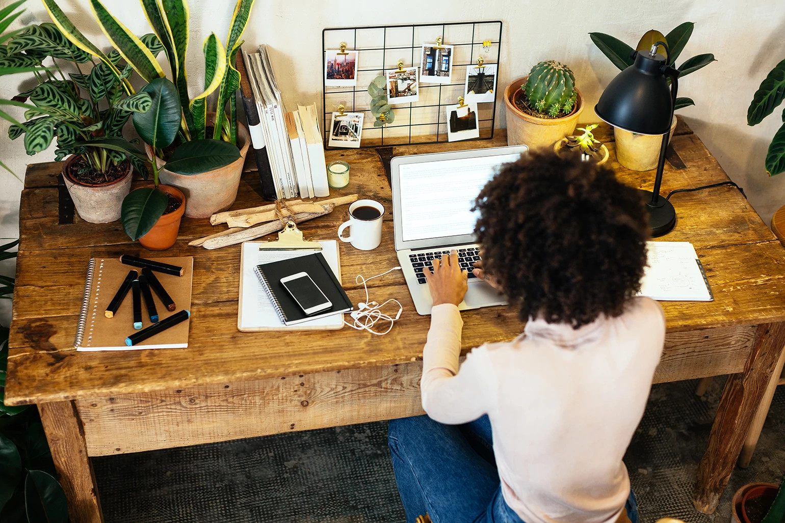 woman sitting at a desk working on a computer