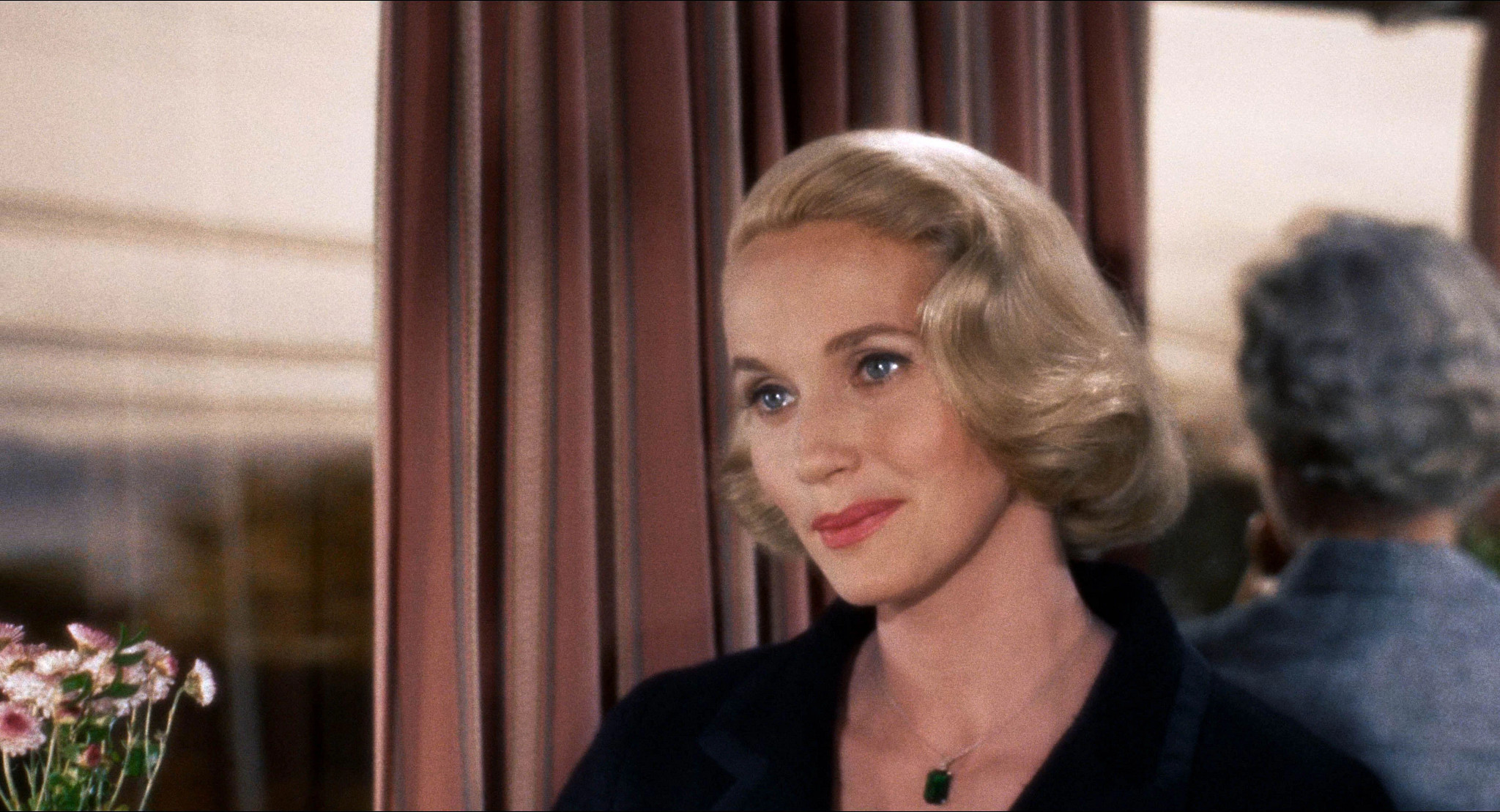 a headshot of a smiling eva marie saint as a young star