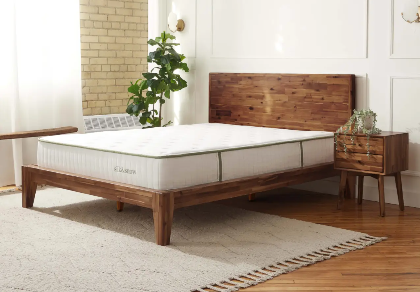 The Silk & Snow Organic Mattress on display in a bright room