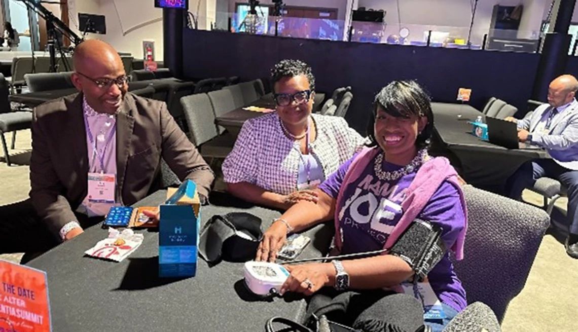 Participants at the Alter Dementia Summit learned how to measure their blood pressure Participants at the 2025 Alter Dementia Summit sit with a portable blood pressure cuff