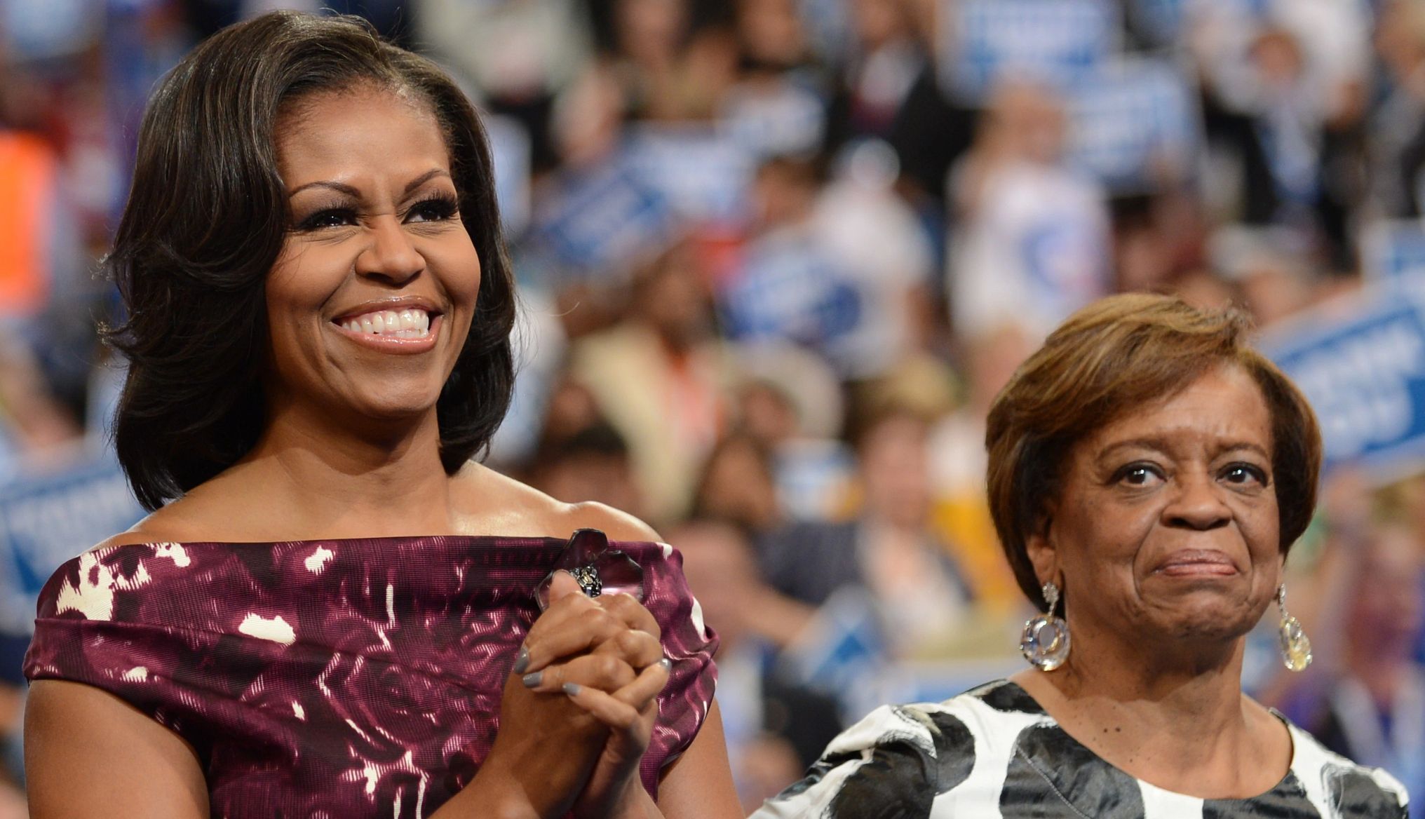 Michelle Obama Shares Her Caregiving Experience michelle obama smiling beside her mother, marian robinson