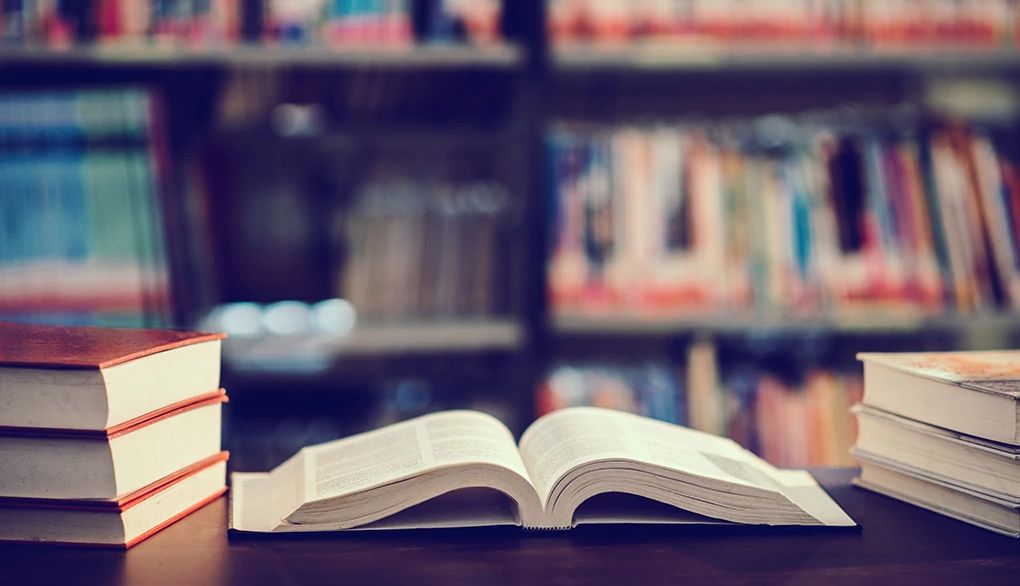 Techniques can make it easy to absorb information from a book An open book on a table in a library
