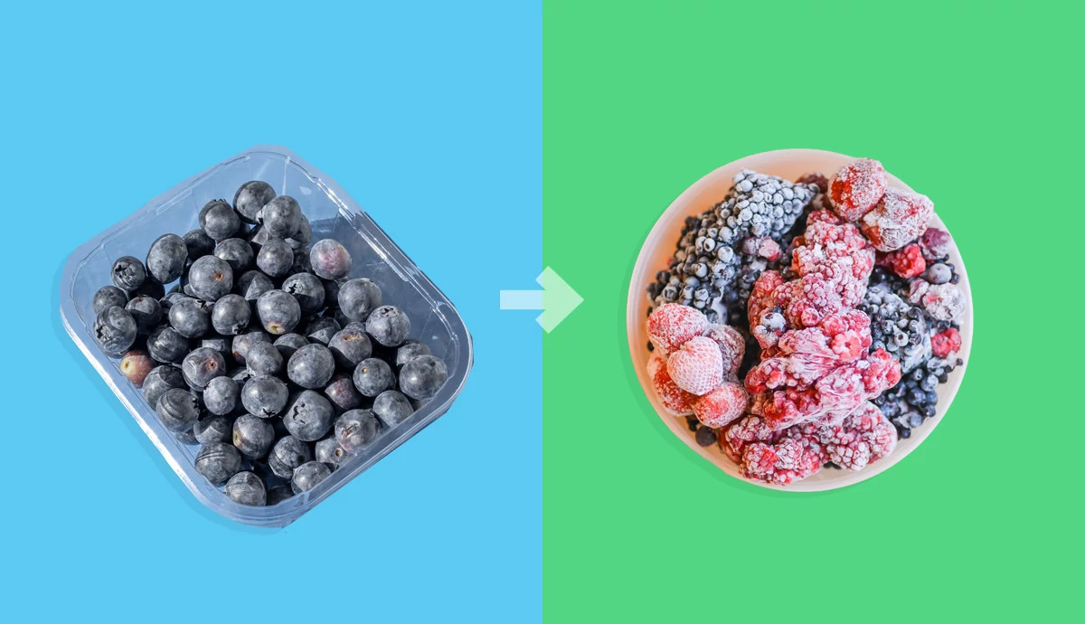 Fresh blueberries next to frozen berries