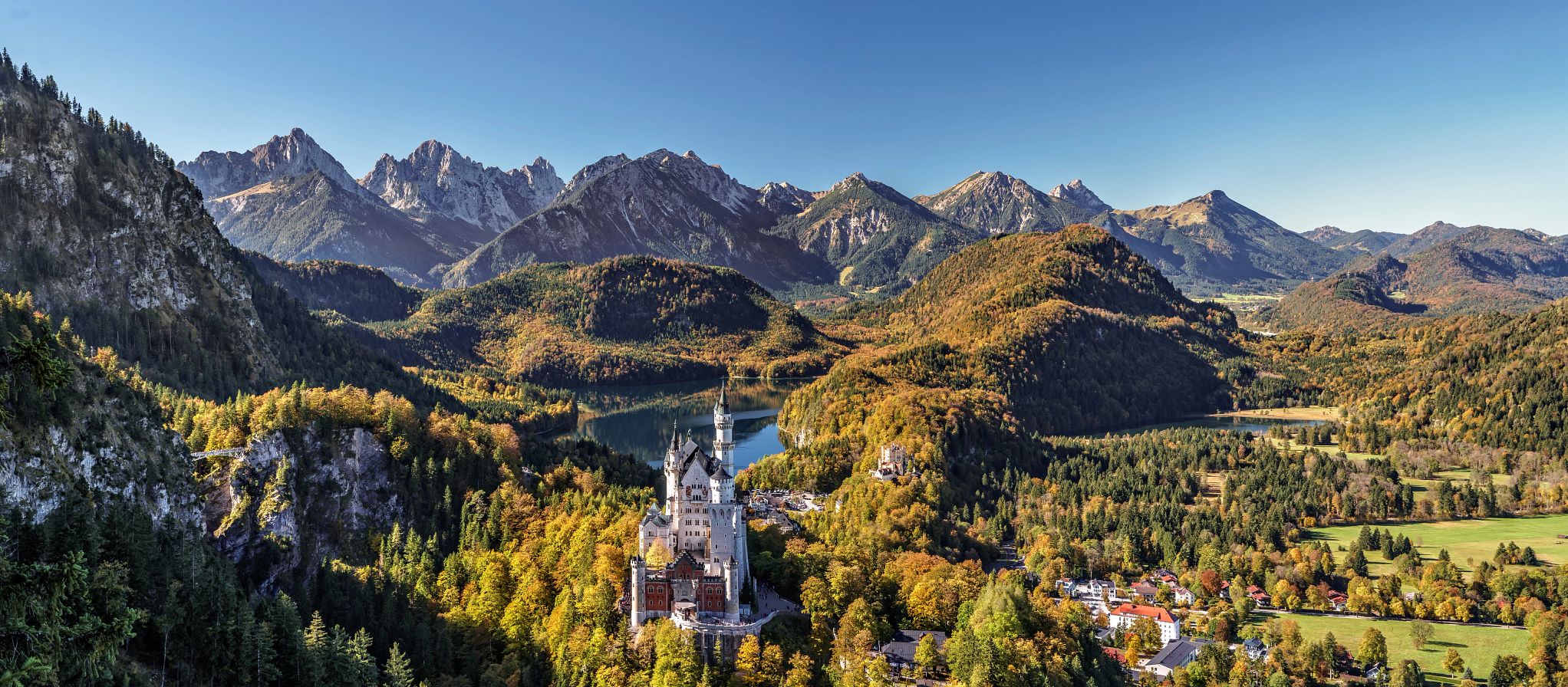 European Storybook Vacations Neuschwanstein Castle surrounded by trees in germany