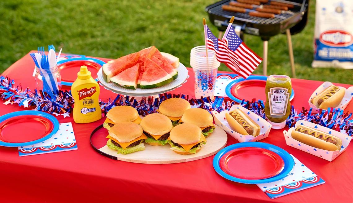 10 Dollar Store Finds for a Patriotic July Fourth a picnic table with various foods and decorations