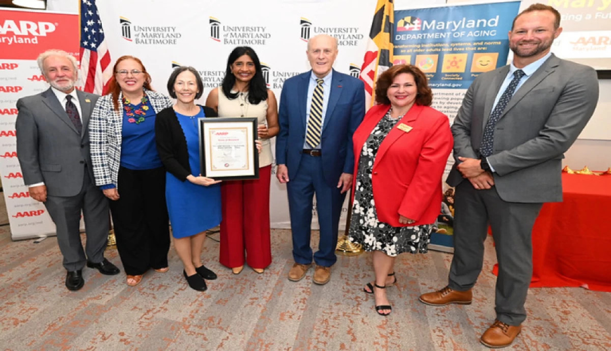 Maryland officials and aarp staff pose for a photo together
