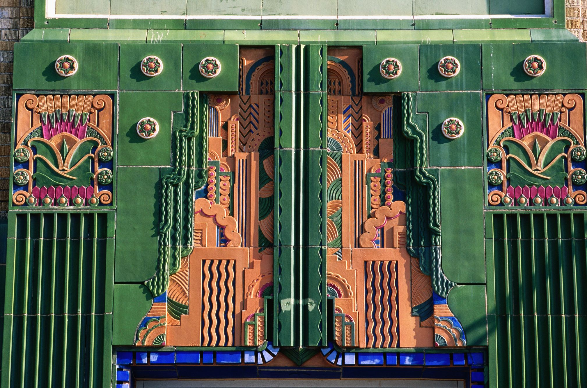 Visit These Cities to See the Art Deco Aesthetic an elaborate architectural detail painted in bold colors