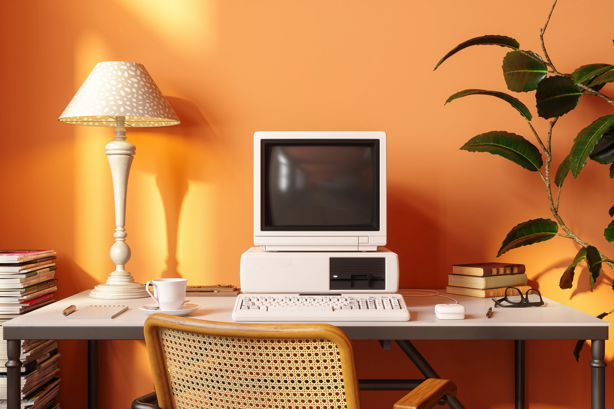 a photo shows a 1990s era computer and hard drive, sitting on a desk with a lamp