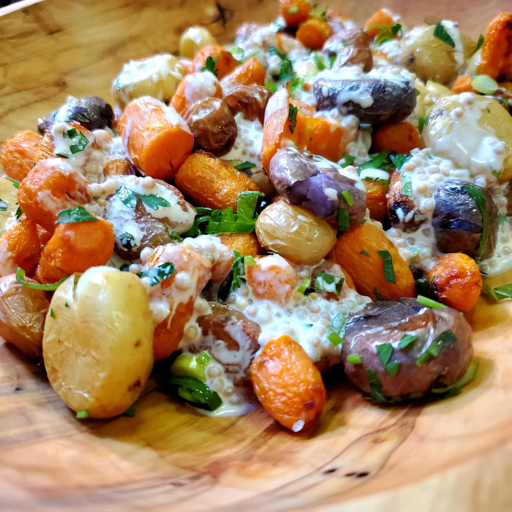 Peewee potatoes and baby carrots in white sauce