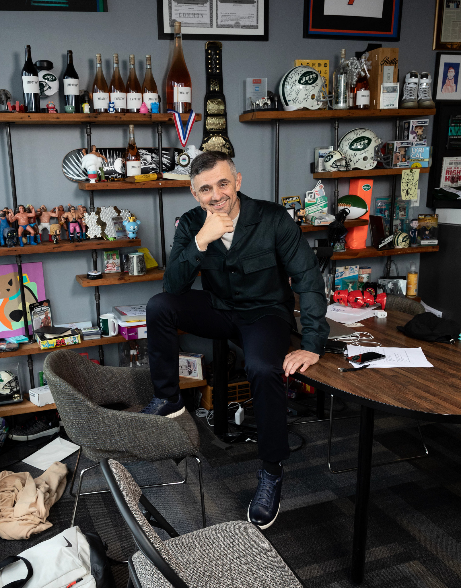 Gary Vaynerchuk is shown sitting on a desk.