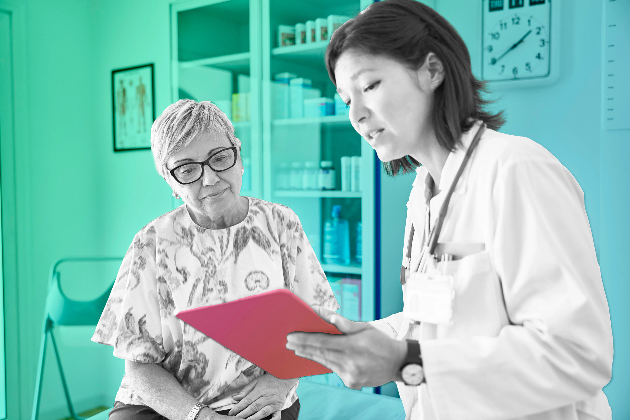 Female doctor sharing test results on a tablet with a patient at a clinic