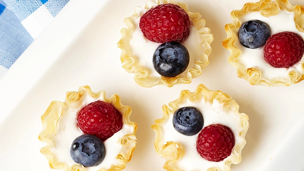 A close-up view of mini berry cream pies